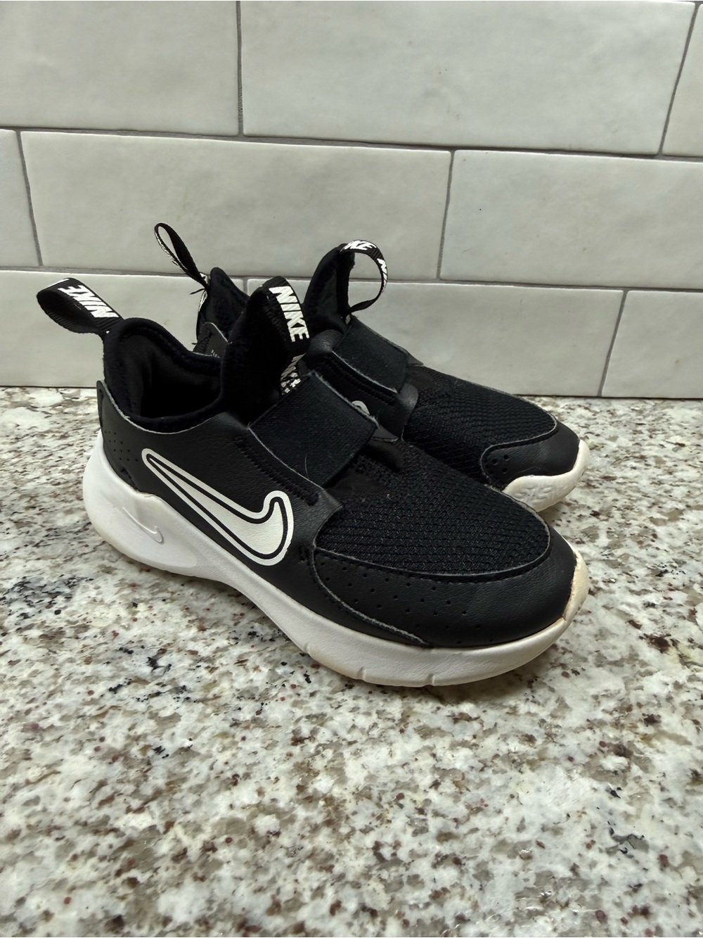 Nike Kids Black and White Slip-On Sneakers with Hook Strap- size 10